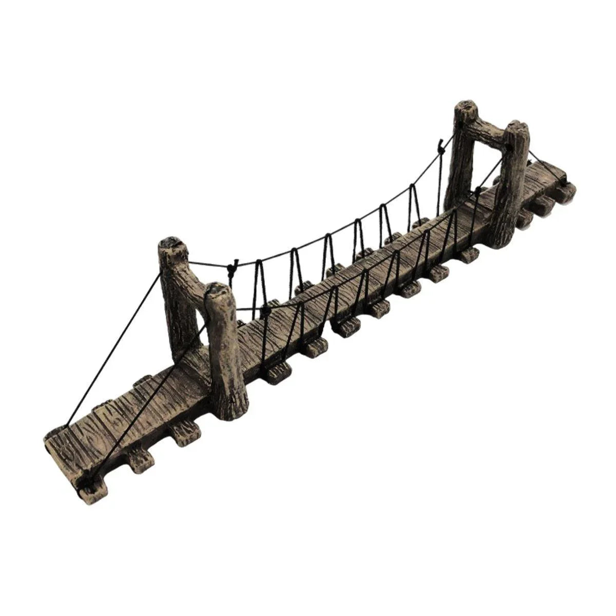 Miniature rustic wooden suspension bridge decor with rope railings on white background