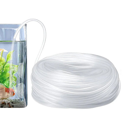 Clear CO2 tubing for aquarium fish tank, shown coiled next to a glass tank with plants