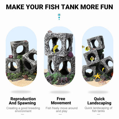 Aquarium decor rocks with holes, fish swimming among stackable cubes for fish tank landscaping.