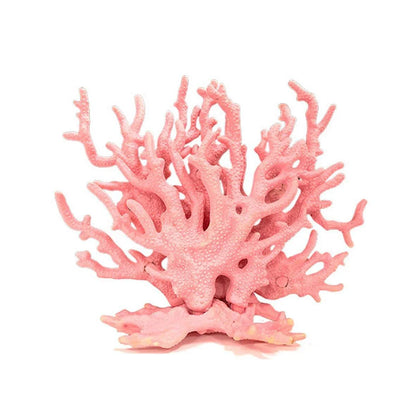 Pink artificial coral ornament with textured branches on white background, home decor or aquarium accessory.