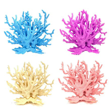 Set of four artificial coral decorations in blue, pink, beige, and peach colors.
