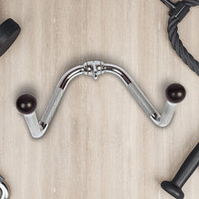 Chrome tricep pushdown attachment with black ball handles on light wood gym floor