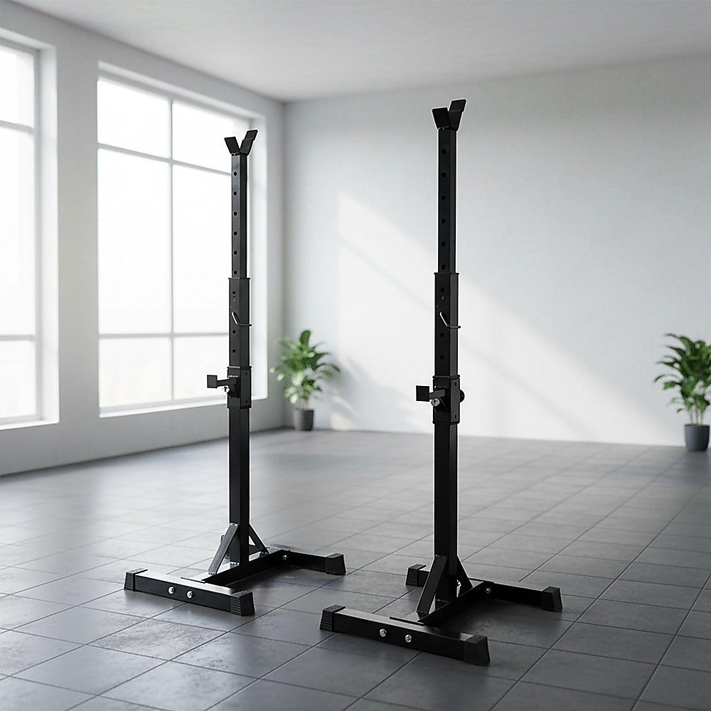 Black squat racks in a bright, modern home gym with tiled floors and large windows