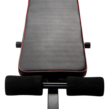 Adjustable weight bench seat with black padding and red trim for home gym workouts