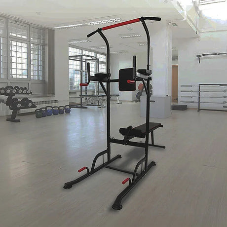 Multifunction power tower workout station in a modern gym with weights and benches