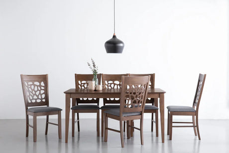 Modern dining room set with six wooden chairs, cutout backs, and a wooden table under a black pendant light