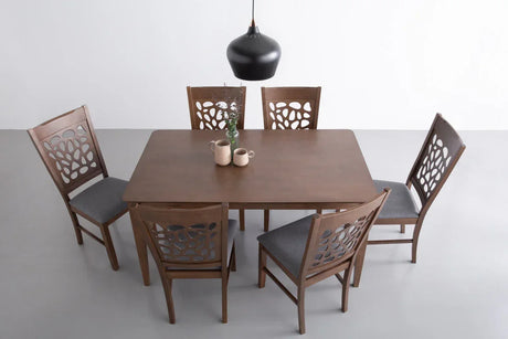 Modern wooden dining table set with six chairs, gray seats, black pendant lamp, and mugs