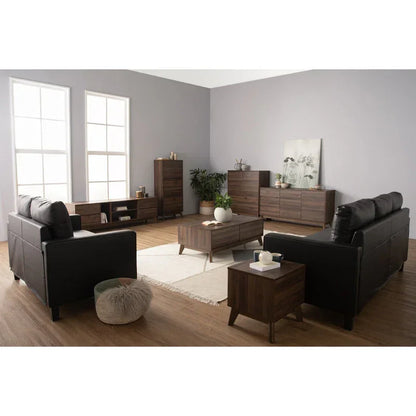 Modern living room with black sofas, walnut wood furniture, and gray walls