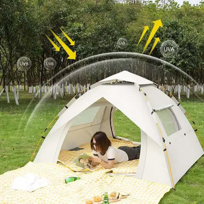 Person lying inside white UV and UVB protective tent in green park surrounded by trees