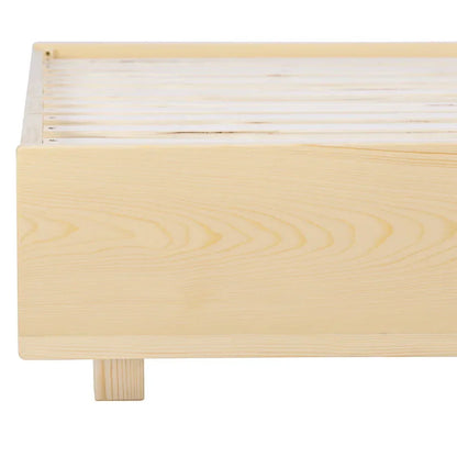 Close-up of a light natural wood bed frame with wooden slats and block legs