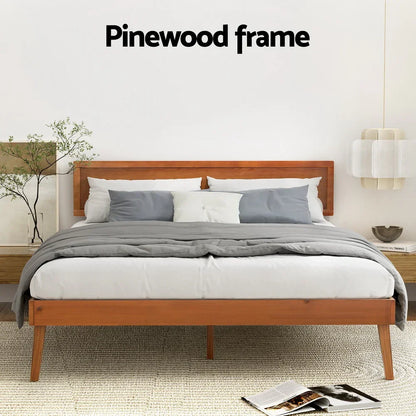 Modern bed with pinewood frame, gray bedding, white and gray pillows in minimalist bedroom