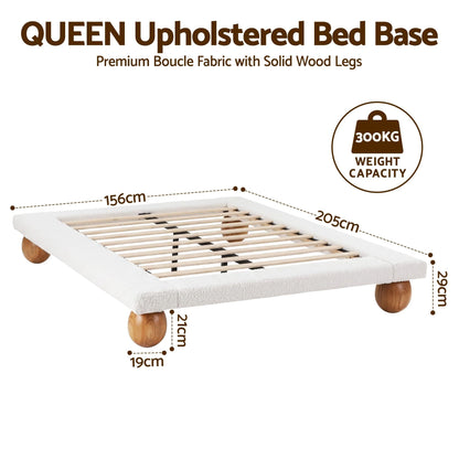 Beige and white textured boucle queen bed frame on rounded rubberwood legs