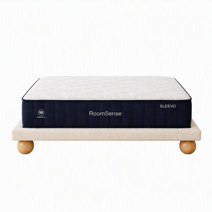 Solid rubberwood legs under a boucle upholstered queen bed frame