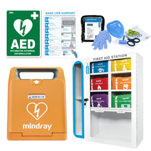 AED defibrillator kit with first aid cabinet, prep kit, gloves, scissors, and emergency guide